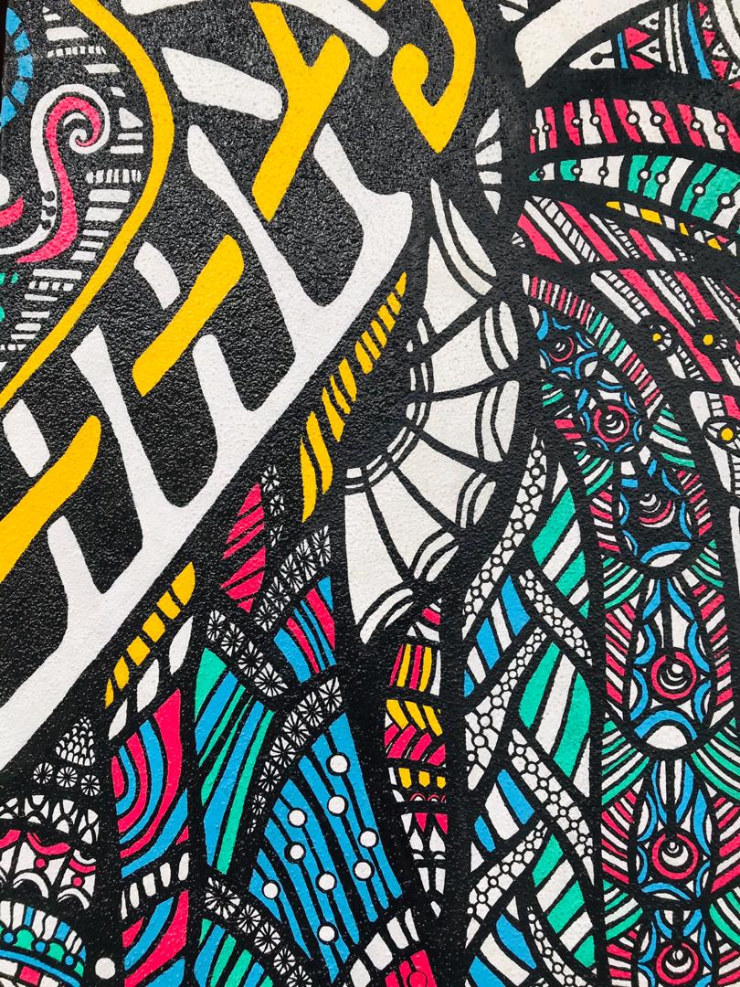 Hand-painted elephant mural in bold colours and intricate patterns